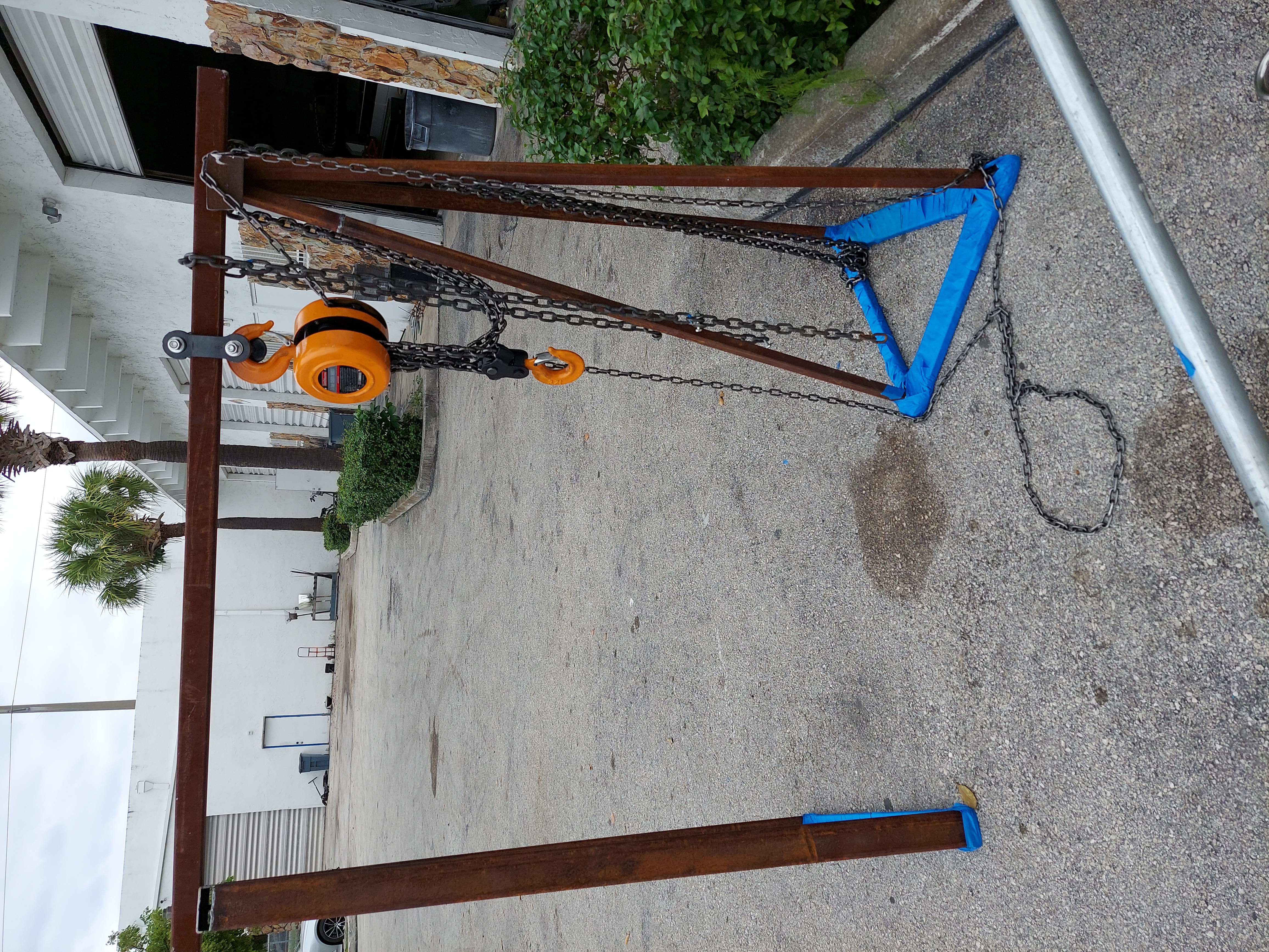 Custom micro crane built for engine replacement in the marina slip