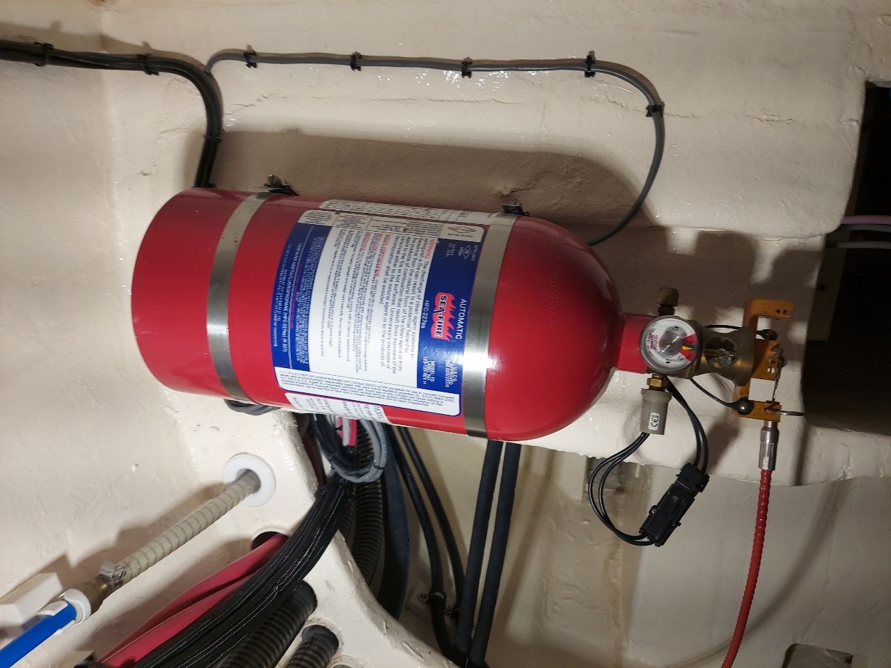 Automatic fire suppression system installed in a catamaran engine compartment
